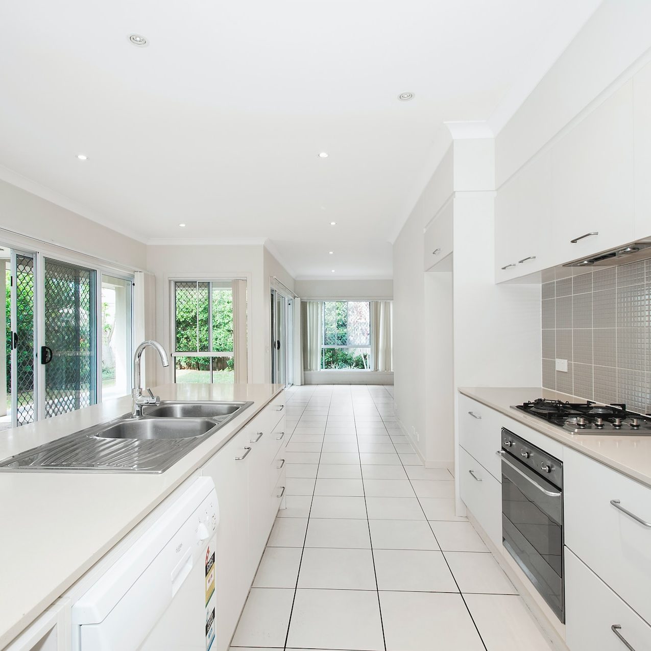 white wooden kitchen cupboards